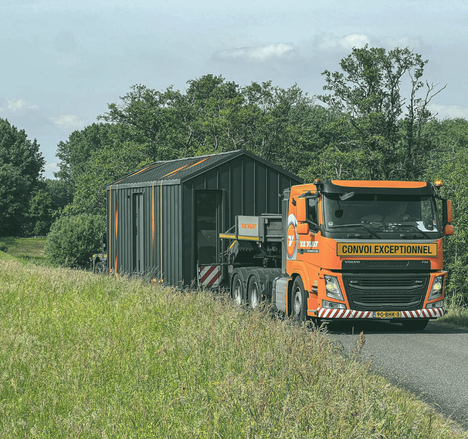 Tiny House on an Orange Truck as Cargo