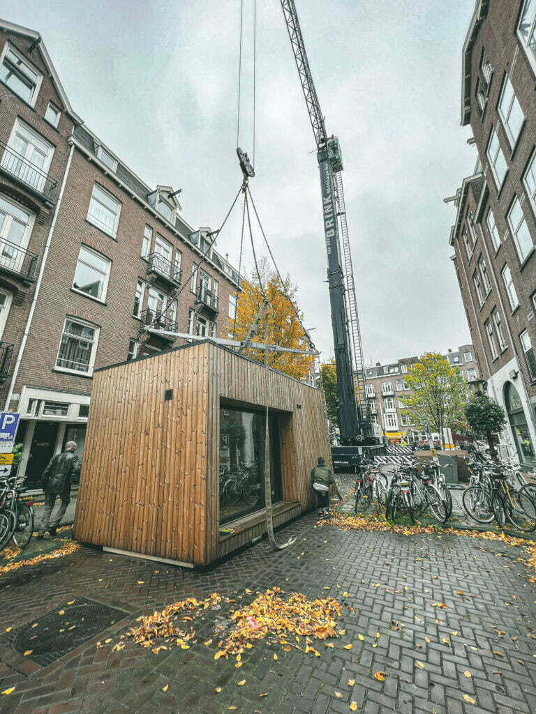 wooden custom tiny house being installed in Amsterdam