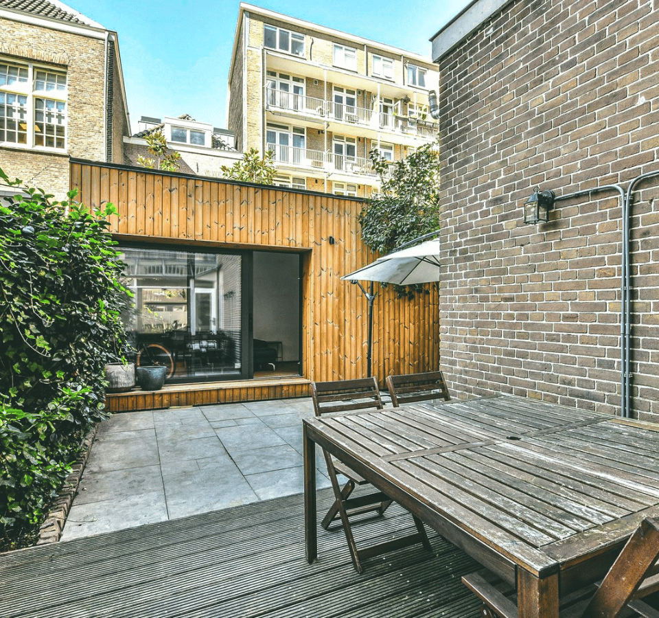 Custom Tiny House Retreat in the Backyard, Complete with a Charming Outdoor Table