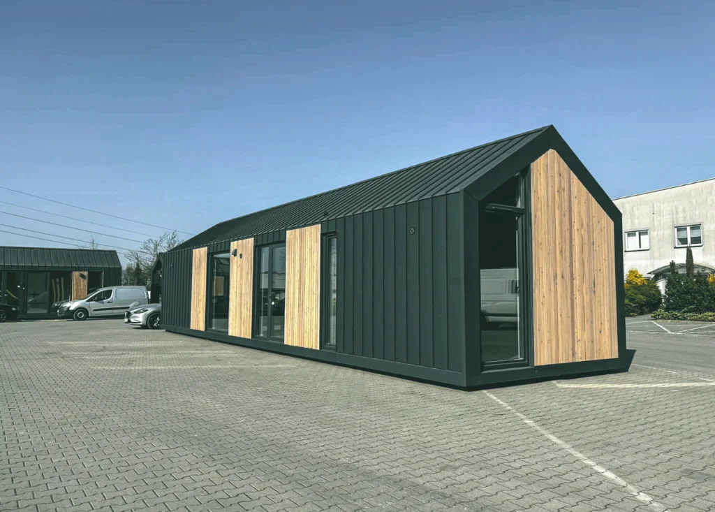 Tiny home in a parking lot, blue sky, extra-large house, for sale
